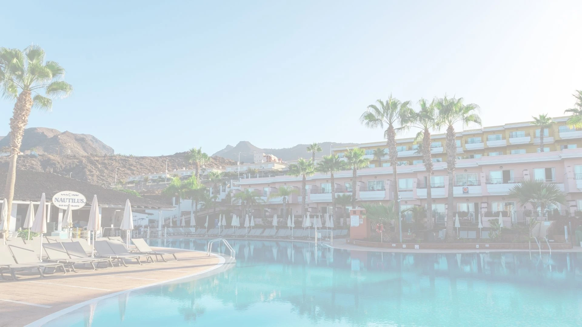 Landmar Biosphere logo over a resort pool, perfect for vacation.