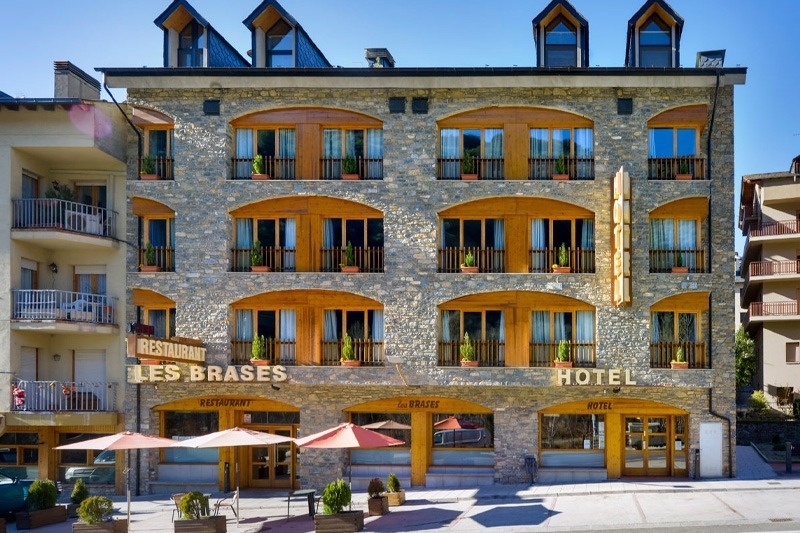 a large stone building with the word hotel on it