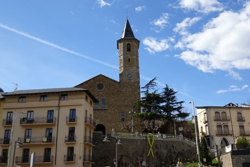 a large stone building with a clock on the top of it
