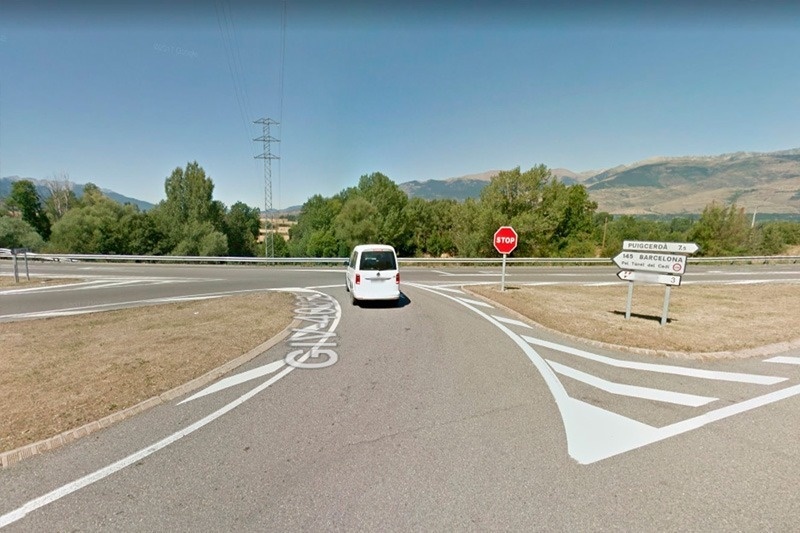 a stop sign is at the intersection of a road