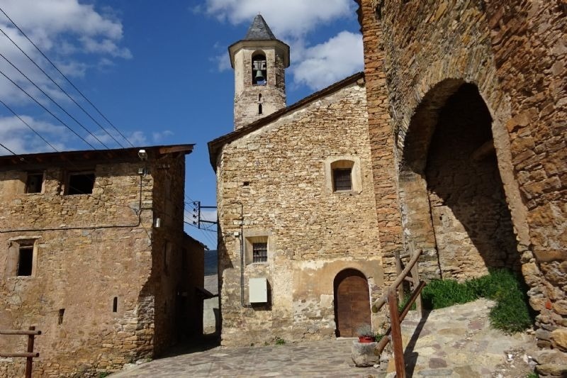 a stone building with a bell tower on top of it