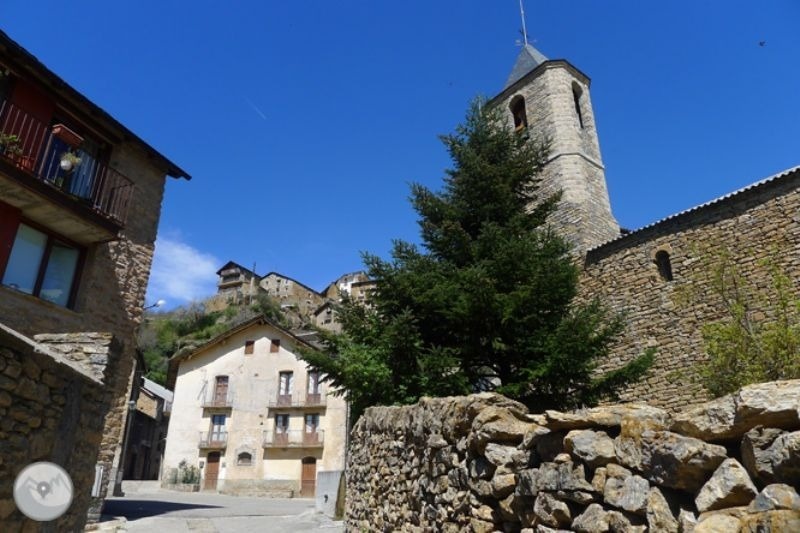 a stone building with a bell tower in the background