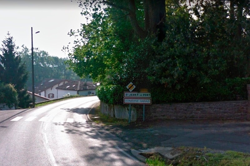 a sign on the side of a road says st jean du port