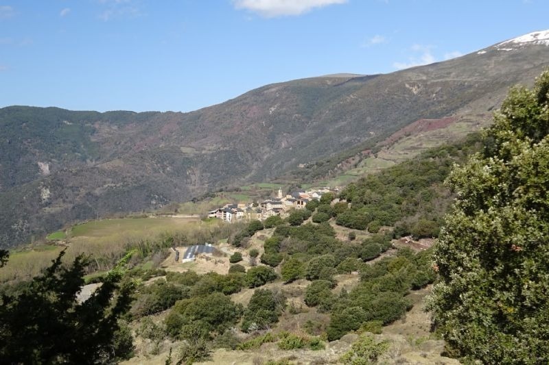 a small village sits in the middle of a valley