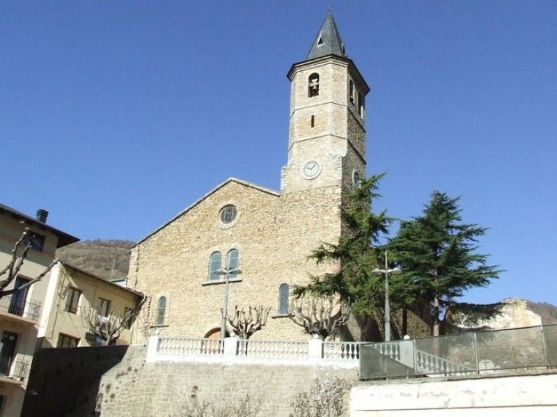 a large stone building with a clock on the top of it
