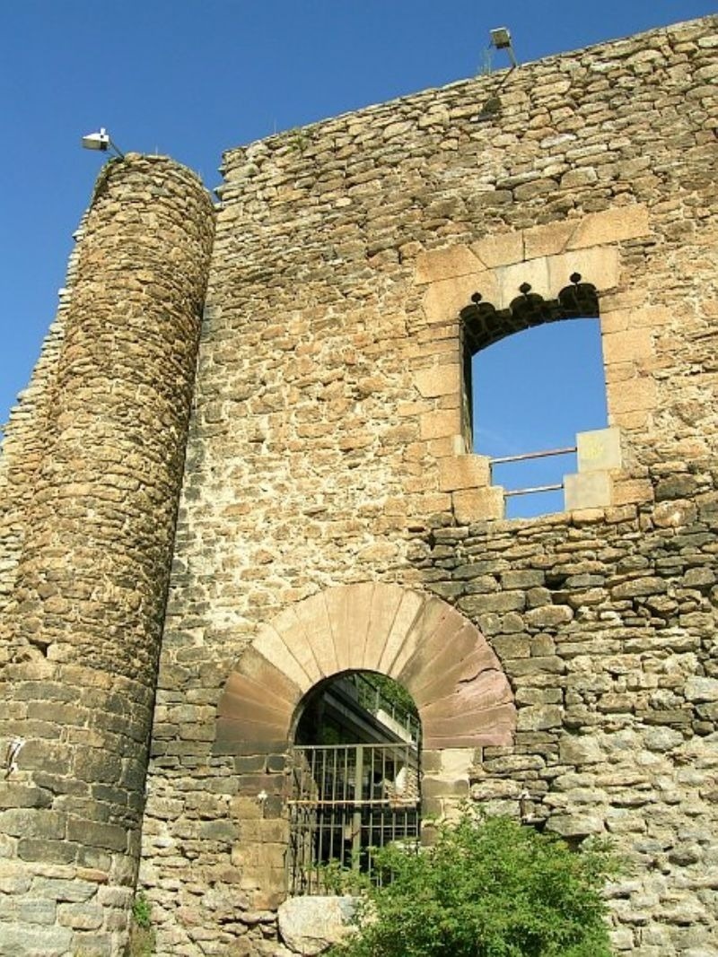 a stone wall with a hole in the middle of it