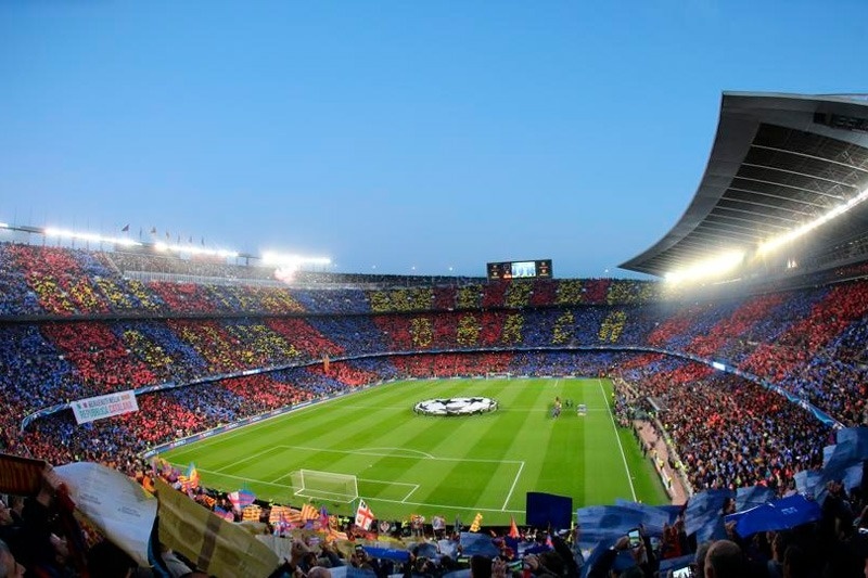 a soccer stadium with a banner that says ' a barcelona club ' on it