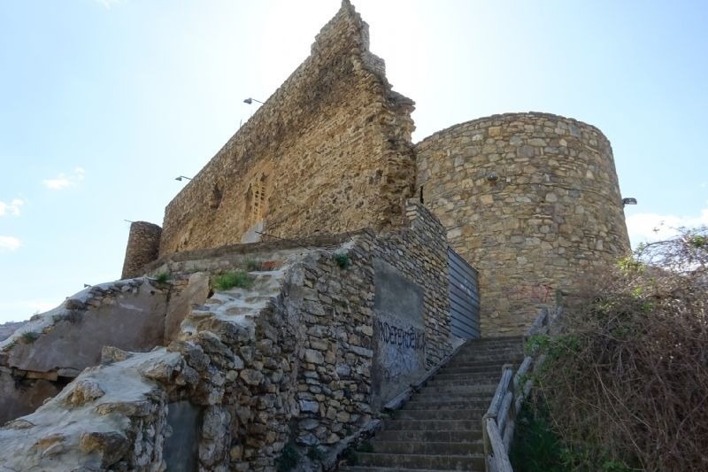 stairs leading up to a stone wall with graffiti on it that says " no perfect "