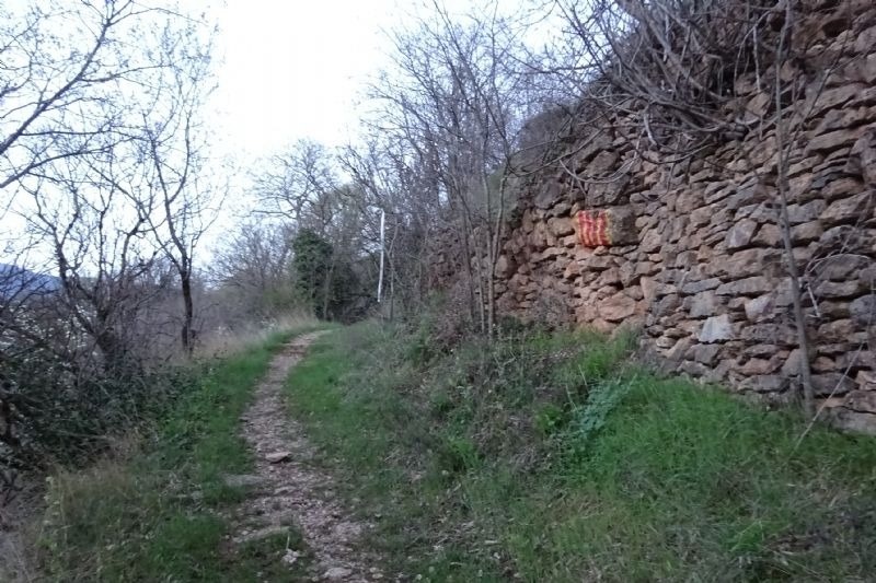 a stone wall with a flag painted on it