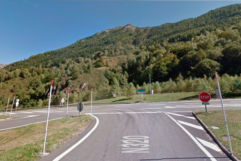 a stop sign is on the side of the road