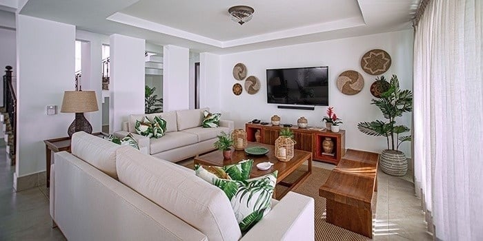 a living room filled with furniture and a flat screen tv .