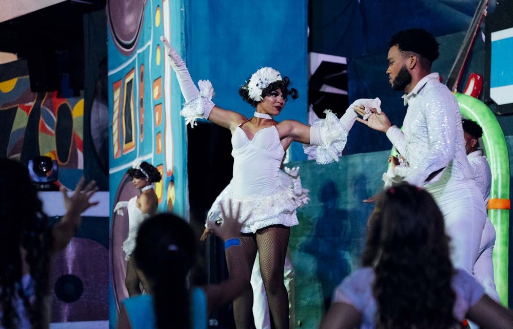 LHVC Resorts: Corpo cabaret show with performers in white attire.