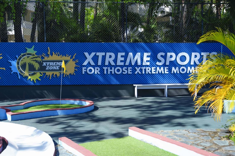 LHVC Resorts: Xtreme zone mini-golf with flag and 'Xtreme Sports' banner.
