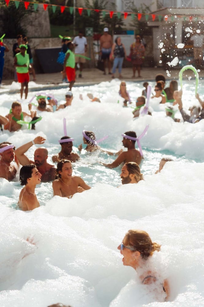 LHVC Resorts: Foam party fun with friends in the pool. Unforgettable celebration!