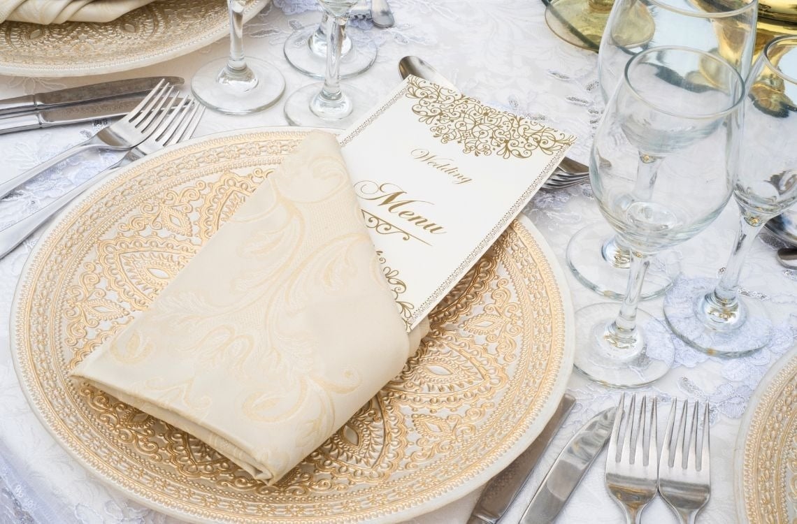 a woman sits in a hot tub with a drink in her hand