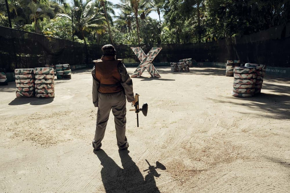 Paintball player at LHVC Resorts: Corpo, geared up for adventure.