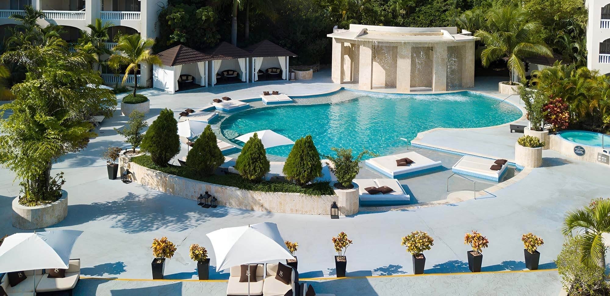 a large swimming pool with a sign that says no diving
