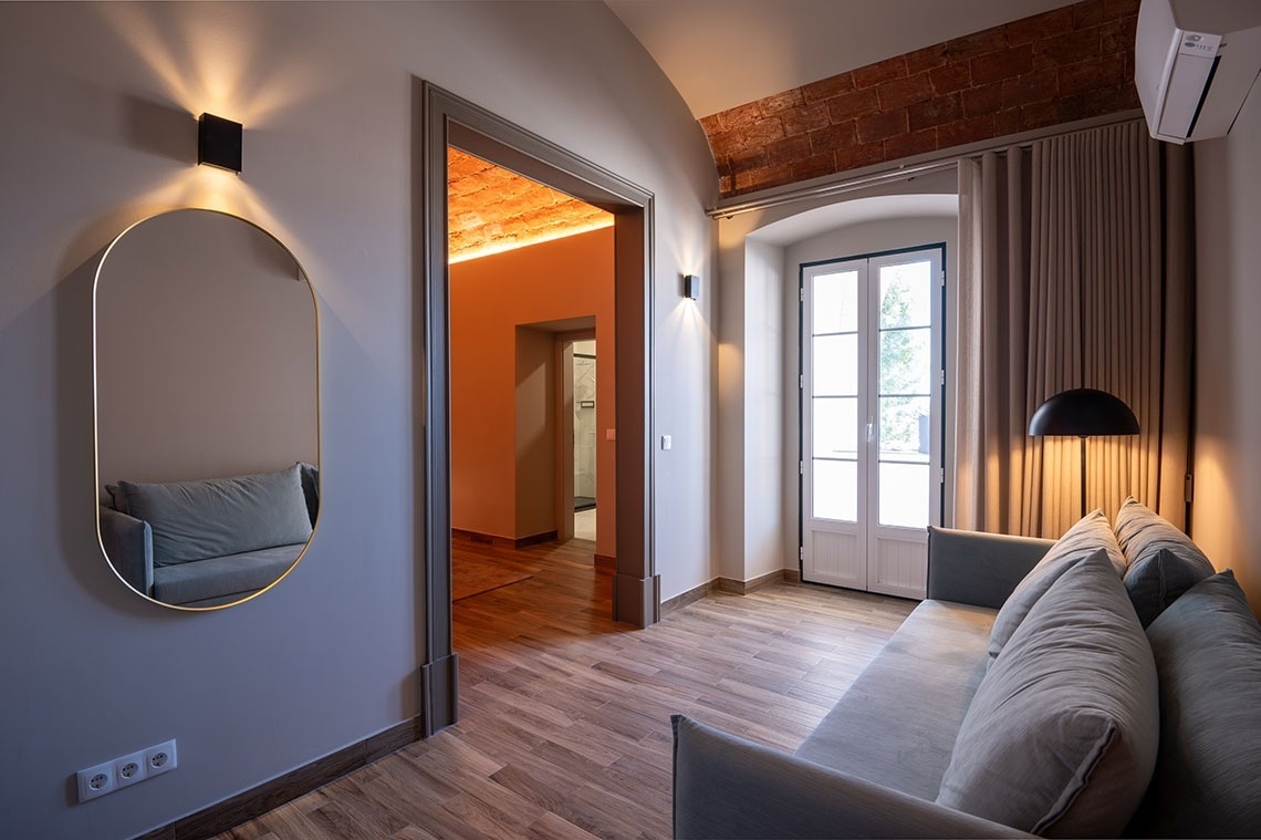 a hotel room with a bed and a desk