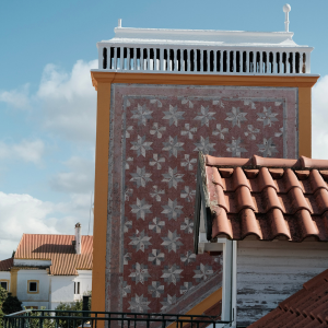 a building with a red and white floral pattern on it