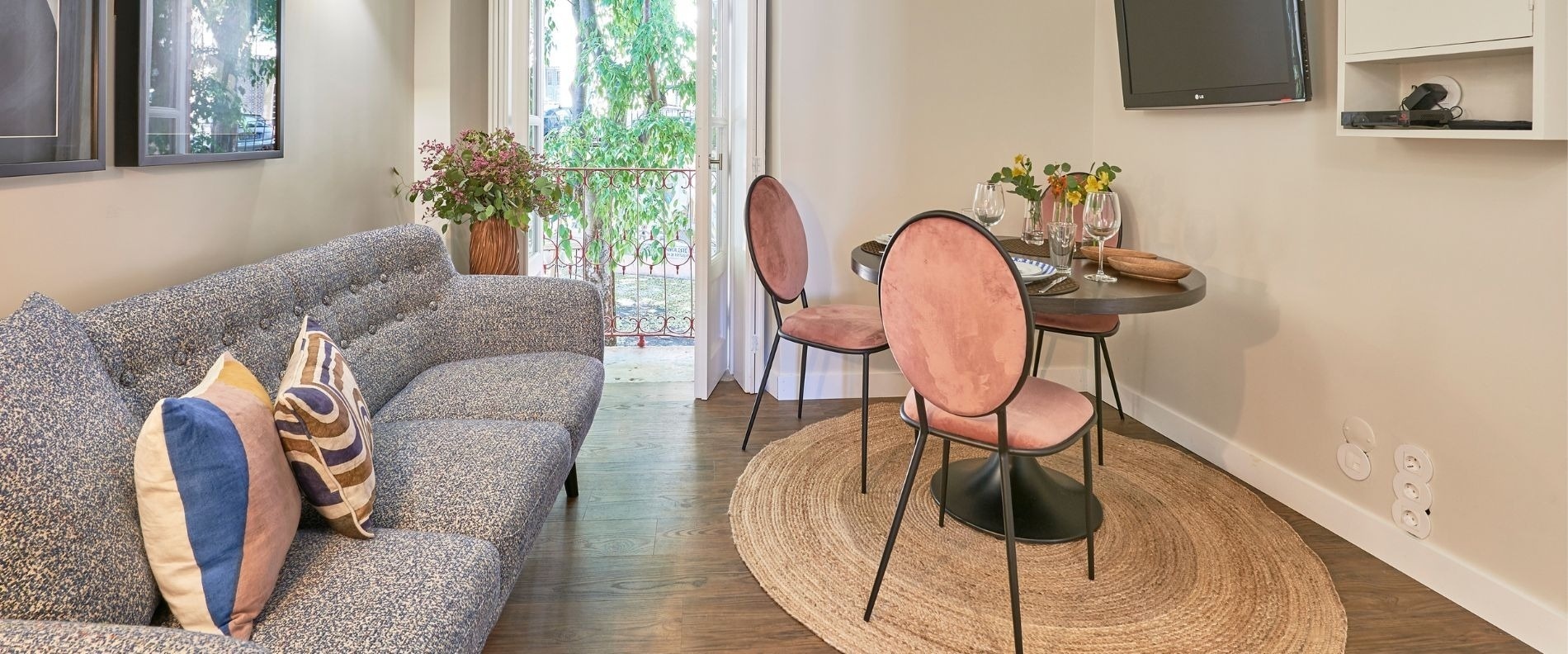 a bedroom with a bed and a table and chairs