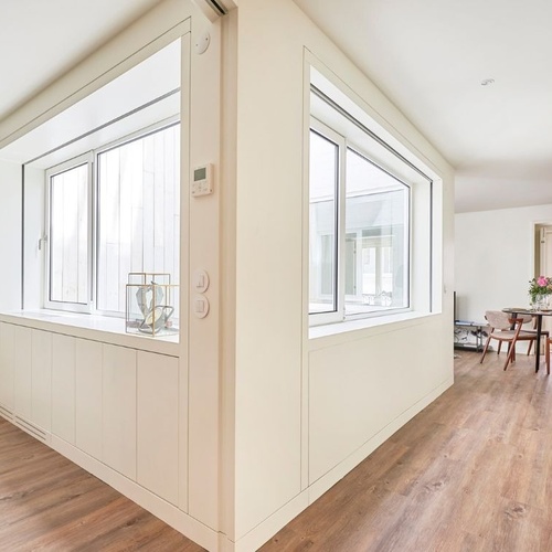 a room with a dining table and chairs in it