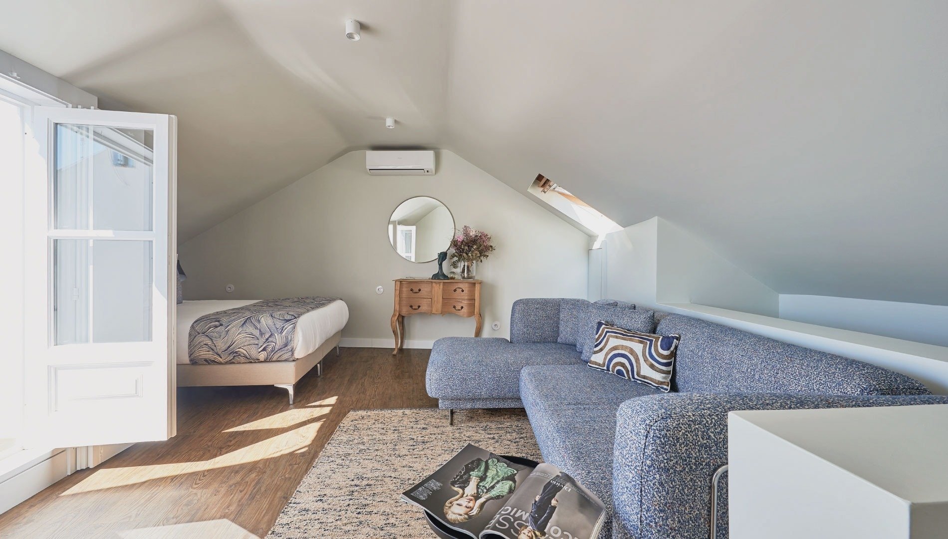 a living room with a couch and a magazine that says ' vogue ' on it