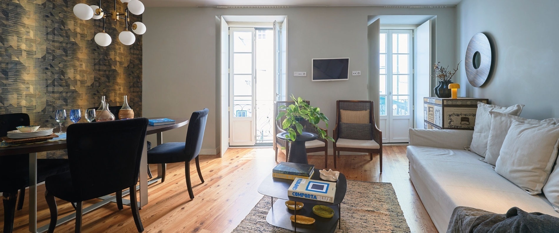 a living room with a couch and a painting on the wall