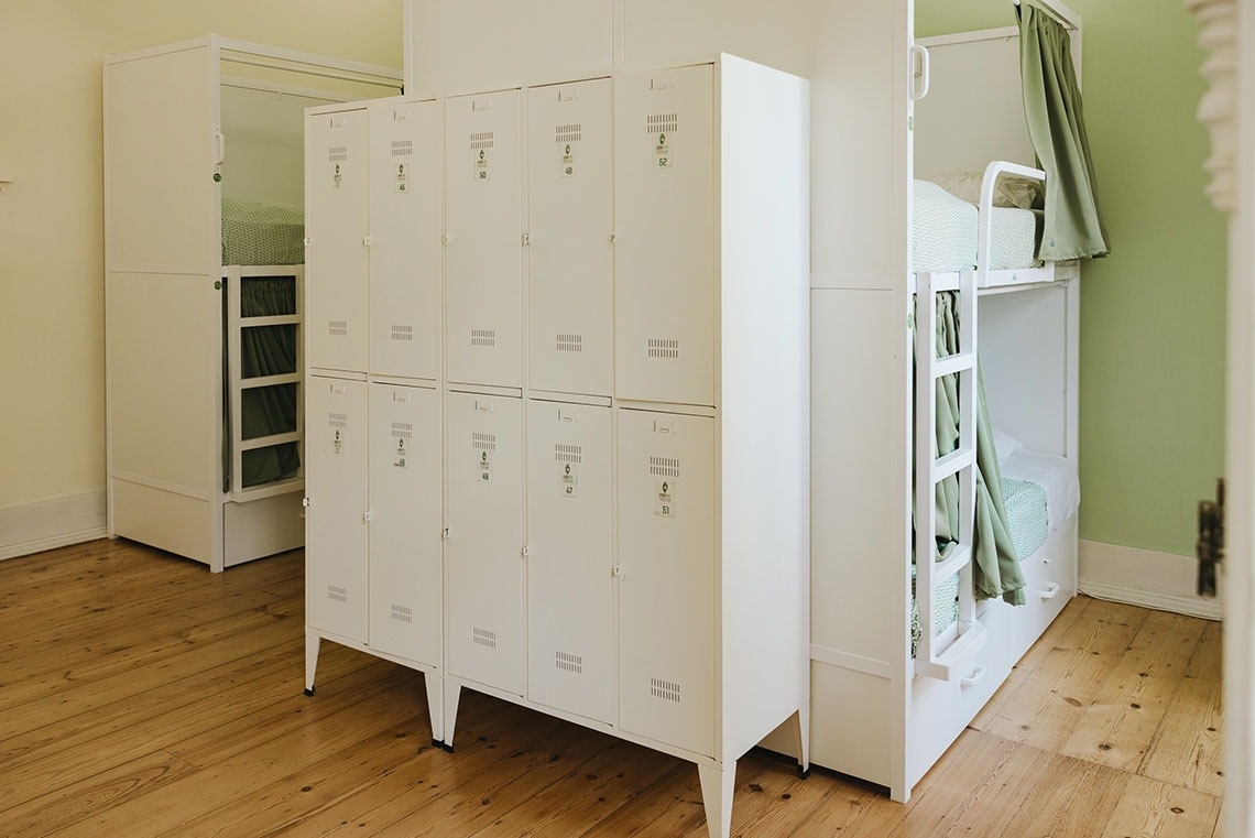 a row of white lockers with numbers 1 through 12 on them