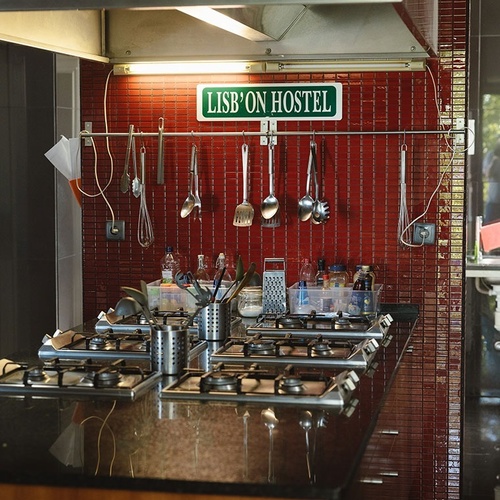 a kitchen with a sign that says lisbon hostel