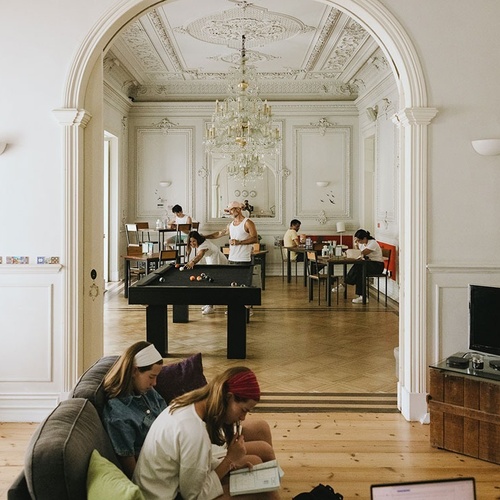a pool table in a room with the number 220 on the wall