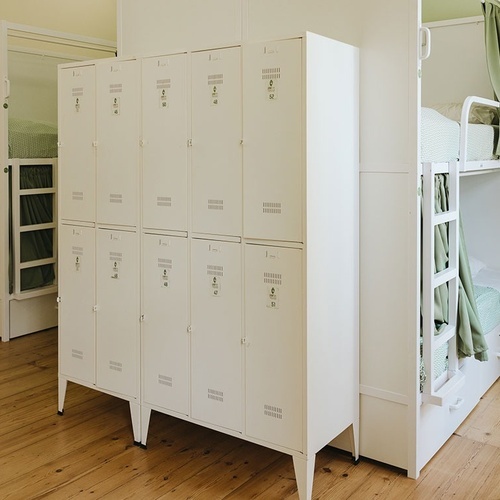 a row of white lockers with numbers 1 through 12 on them