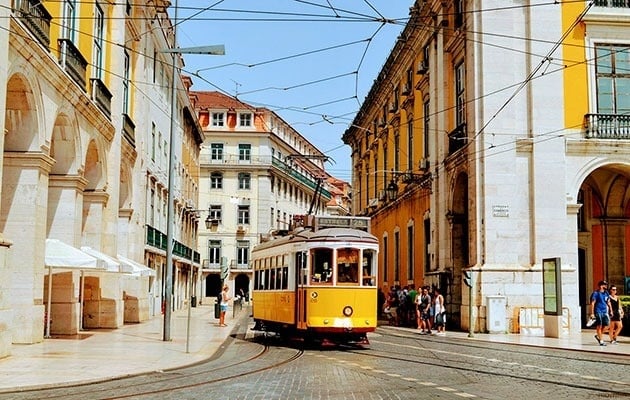 a yellow trolley with the number 9 on it