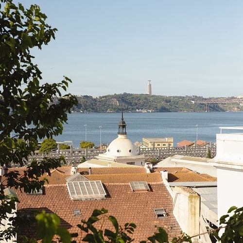 a view of a city with a large body of water in the background