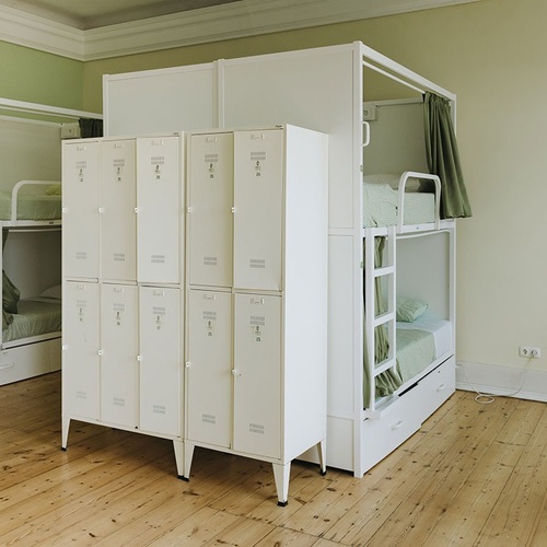 a room with bunk beds and lockers with the numbers 1 through 12 on them
