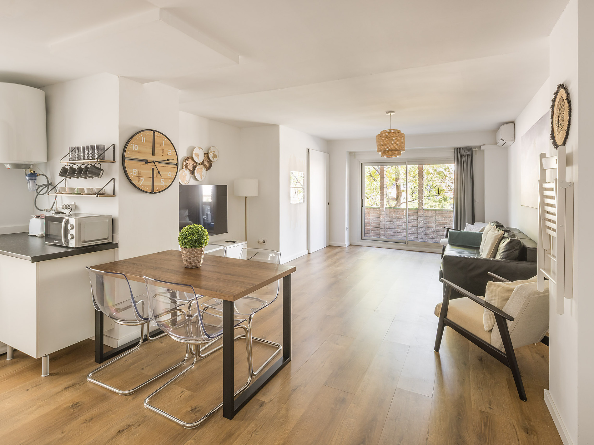 Modern living space with dining table, sofa, and balcony access at Macflats: Ciudad de las ciencias.