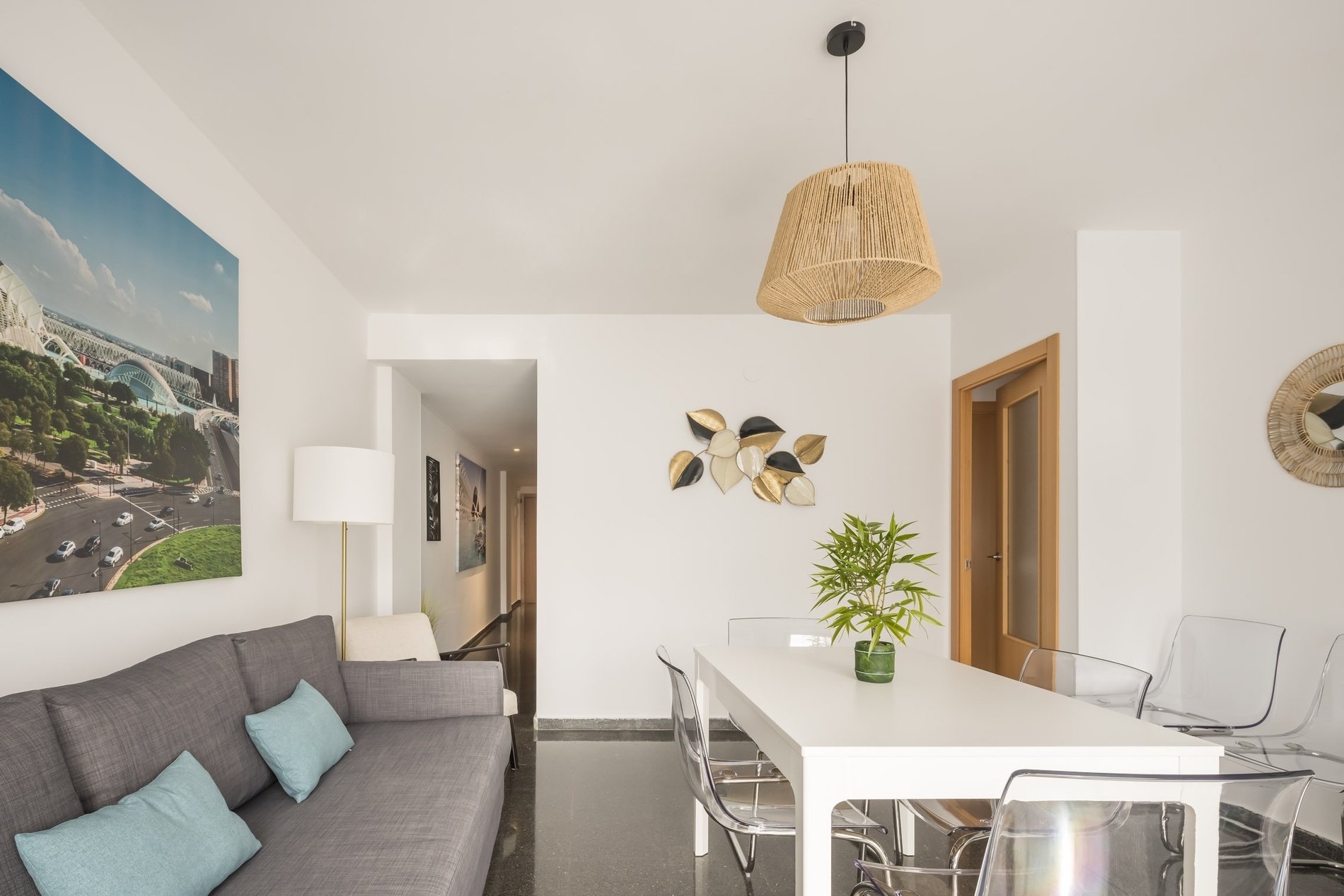 Modern living and dining area with sleek furniture. Book your stay at Macflats Ciudad de las Ciencias | Macflats Valencia | Official Website.