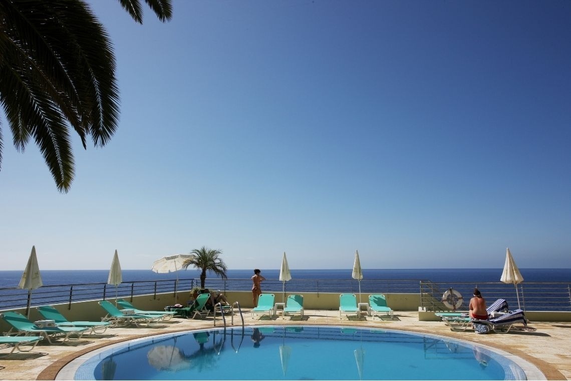 a bathroom with two massage tables and a towel warmer