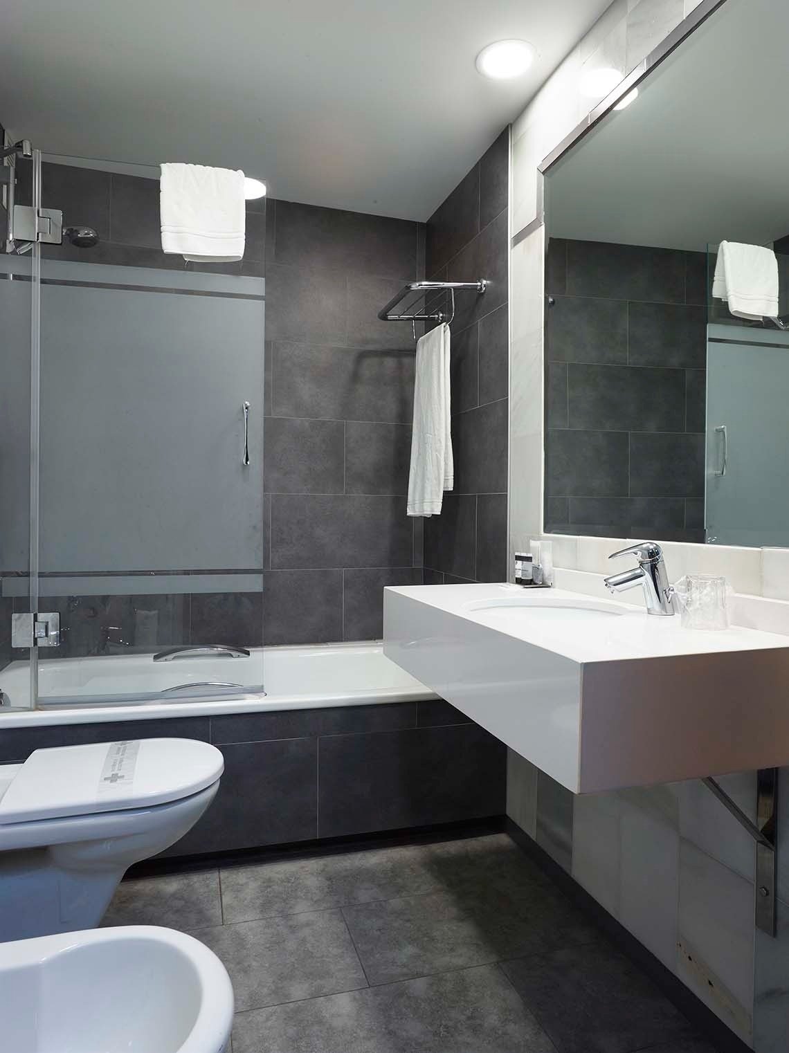 a bathroom with a sink toilet and bathtub