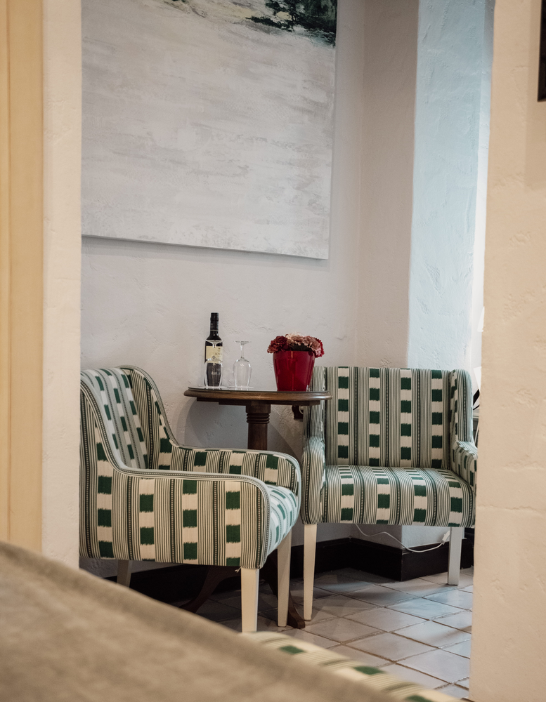 KAIZEN: Malvasia room with comfortable bed and floral decor.