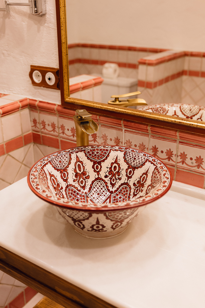 KAIZEN: Malvasia bathroom with shower, mirror, and stylish vanity.
