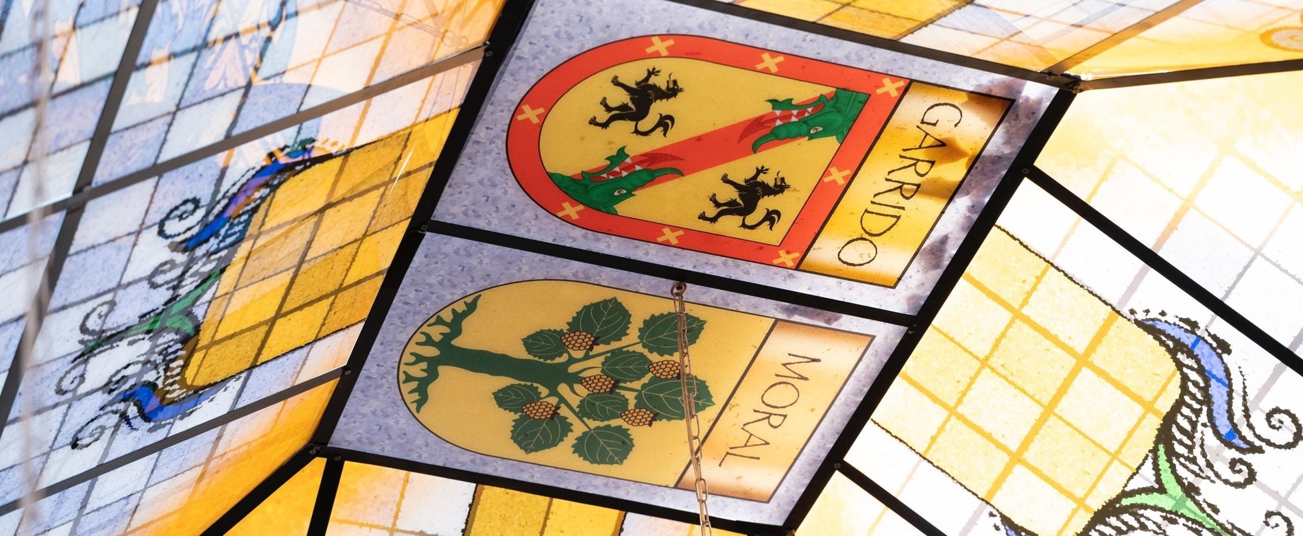 a stained glass window with a coat of arms for garrido moral