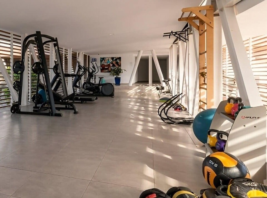 a gym with a bunch of weights including one that has the number 15 on it