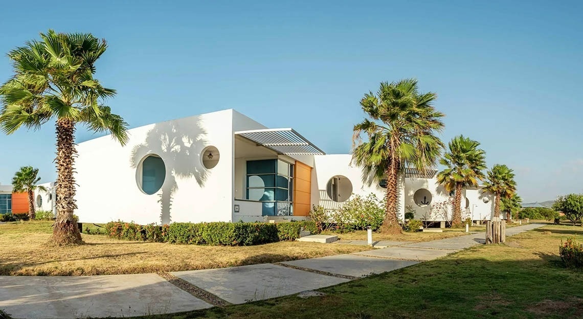 Modern buildings and palm trees at Marina Puerto Velero.