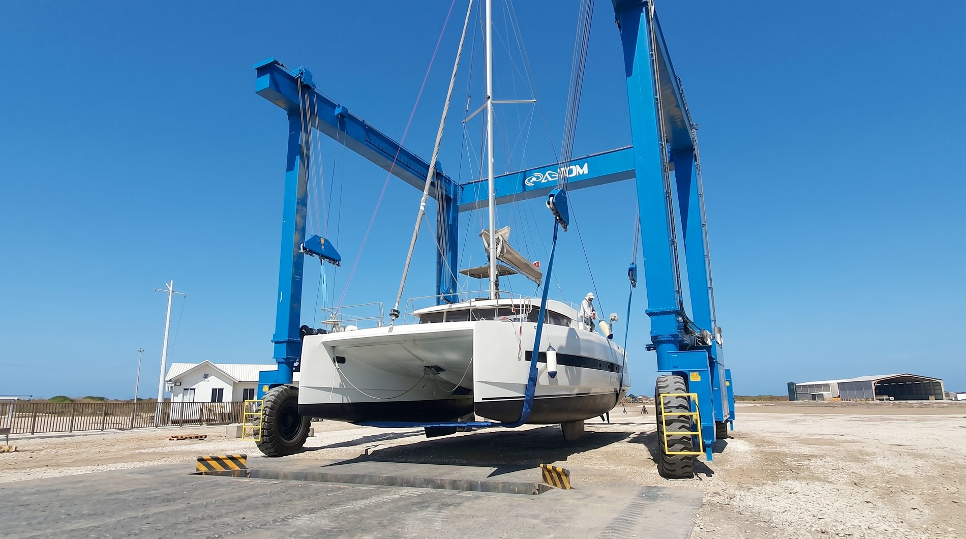 Catamaran being lifted by crane at Marina Puerto Velero.