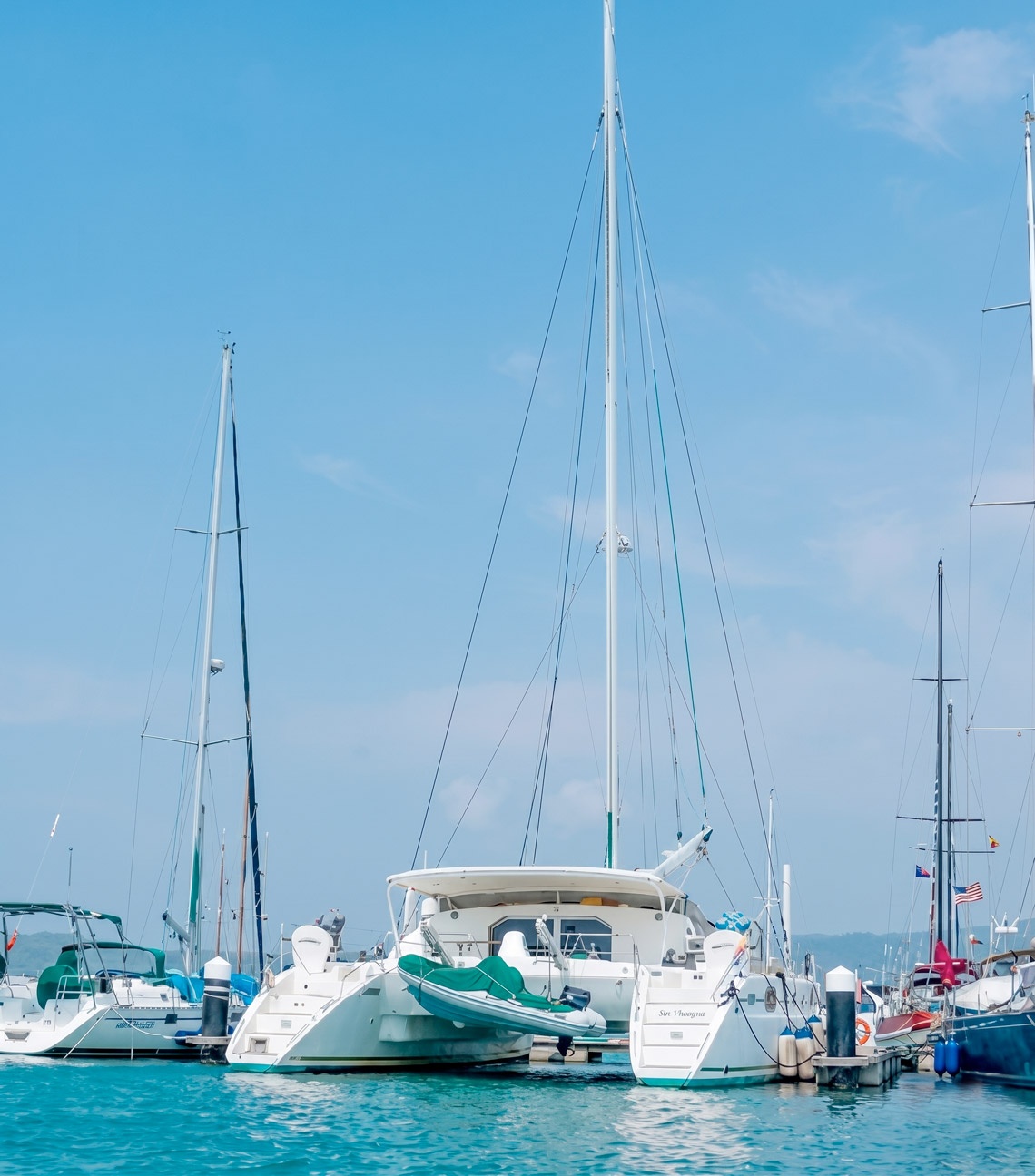 Luxury catamarans docked at Marina Puerto Velero, ideal for nautical getaways.
