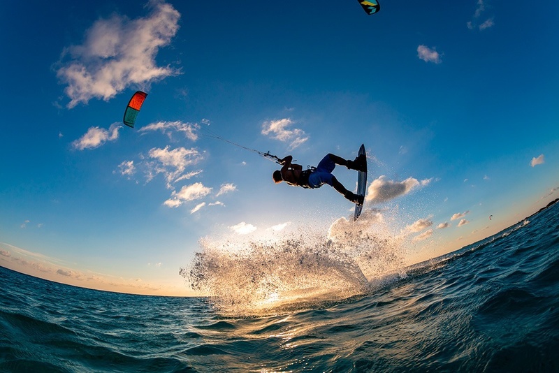 Kitesurfer jumps waves at sunset near Marina Puerto Velero.