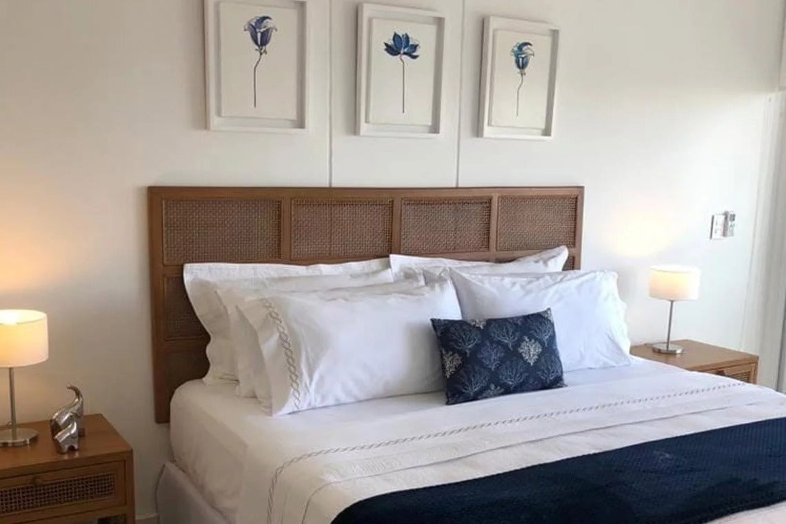 Serene hotel room at Marina Puerto Velero featuring blue floral art.