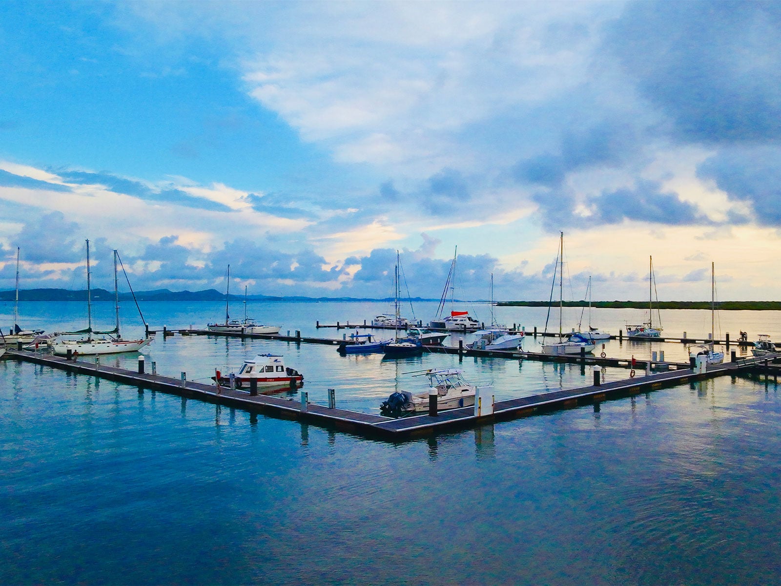 Luxury Dock Slip Rentals · Marina Puerto Velero · Official Web, sailboats, and calm waters at a tropical marina.