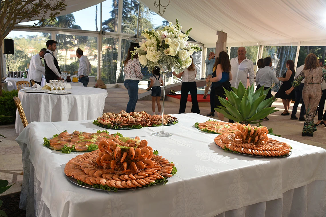 Catering buffet with seafood dishes and floral centerpiece at a hotel Marmoris Hotels.