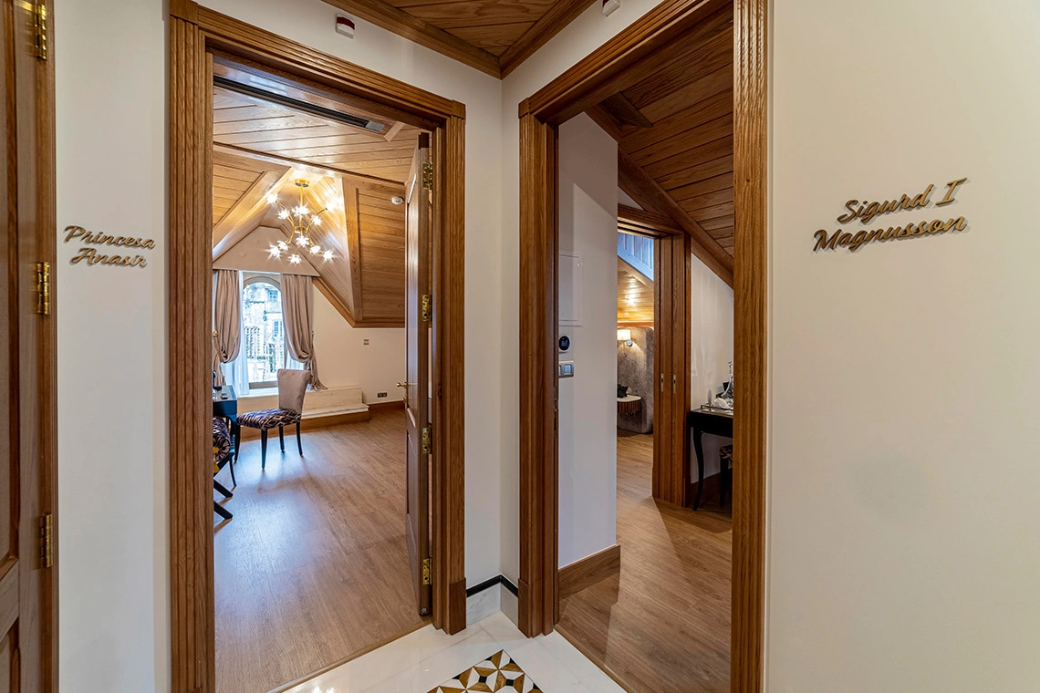 Hotel corridor with ornate doors leading to luxurious rooms Marmoris Hotels named 
